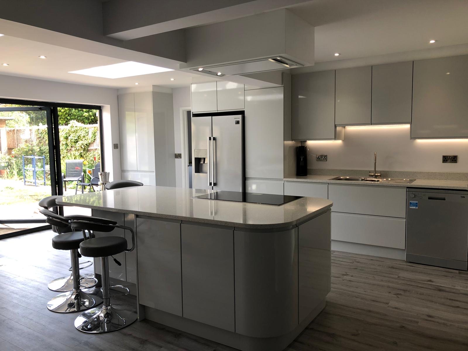 Kitchen grey gloss island bifold doors, made and fitted by Sussex Design Interiors