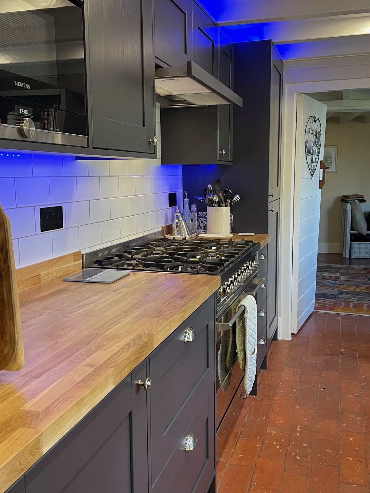 Kitchen navy shaker open shelving blue LED, made and fitted by Sussex Design Interiors
