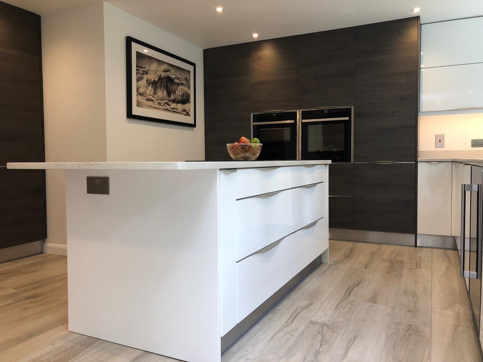 Kitchen white island dark wood framed print, made and fitted by Sussex Design Interiors