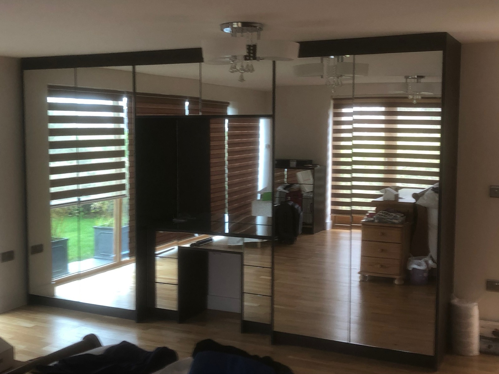 Mirrored wardrobe sliding doors bedroom, made and fitted by Sussex Design Interiors